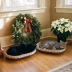 Two cats in Triple-Tier scratchers side by side with a pine Christmas wreath and poinsettias